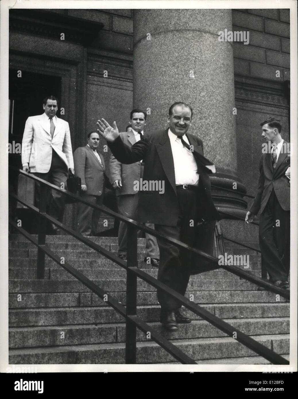 Dec. 09, 2011 - Exclusive.Senator McCarthy Investigates Reds in New York. Photo Shows Senator McCarthy leaving the New York Federal court after holding a session of Investigation . following him is Robert Jones (Assistant to Senator Potter , Republican Representative for Michigan) and Harold Rain ville (Assistant to Senator Dirk sen). top of steps. Stock Photo