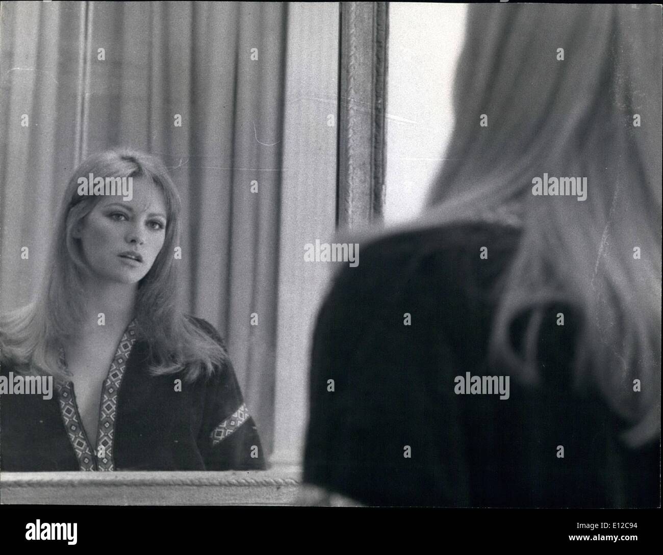 Dec. 16, 2011 - Beautiful French actress Nathalie Delon takes a critical look in the mirror. Nathalie is currently working on her first English film, ''When Eight Bells Toll' Stock Photo