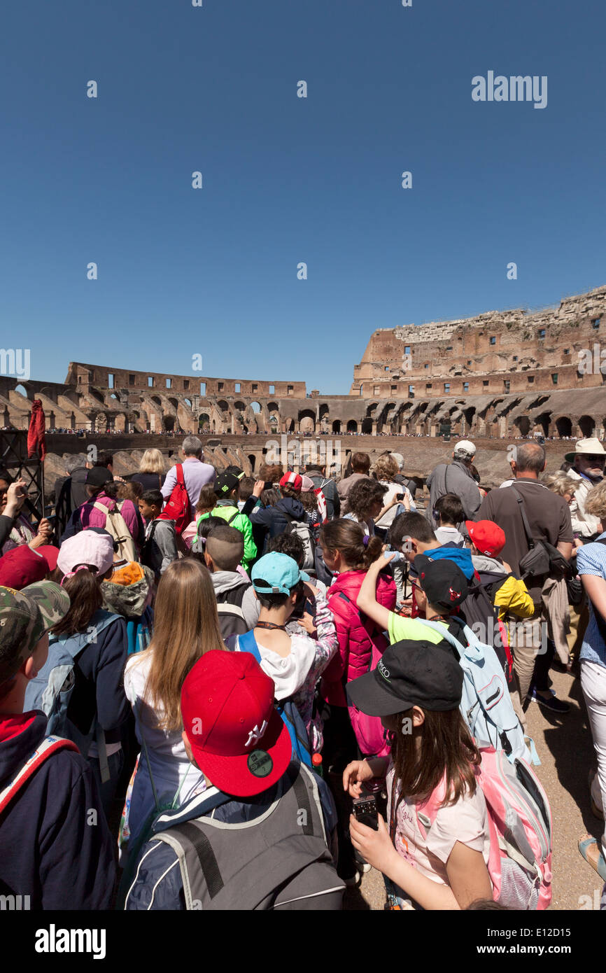 Children in the Colosseum, Rome interior, aka the Flavian Amphitheatre, ancient 1st century AD Roman building Rome Italy Europe Stock Photo