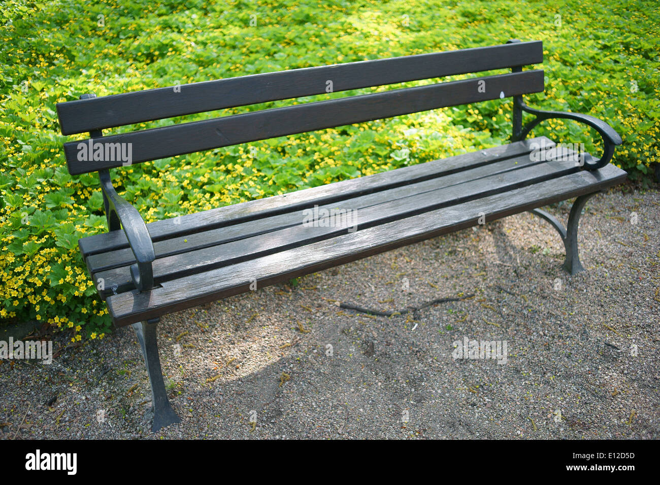 Empty park bench Stock Photo