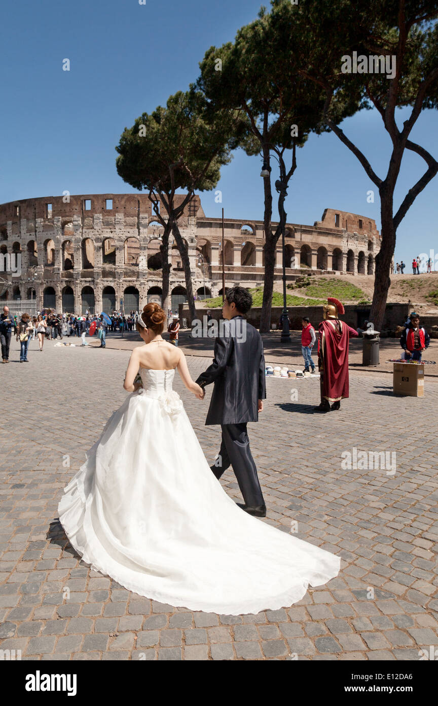 A couple getting married, walking the streets of Rome on their wedding