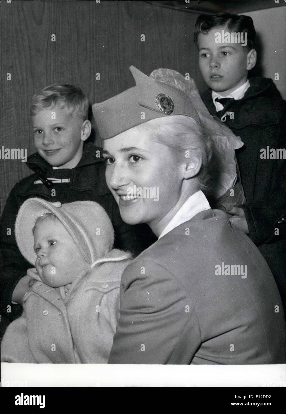 Dec. 19, 2011 - The Durand orphans going off to America As it has been reported, the American couple Durand died in a fire in their flat in Berlin-Zehlendorf. The three children of this couple, seven months old Barbara, seven year old Robert and the eleven year old Billy have flown on Nov. 24th from Berlin-Tempelhof to the USA where they were expected by their American grandparents. OPS: f.l.t.r. Barbara, Robert, Billy and the stewardess who will take special care of the three children. Keystone picture of Nov. 25th, 1958 Stock Photo