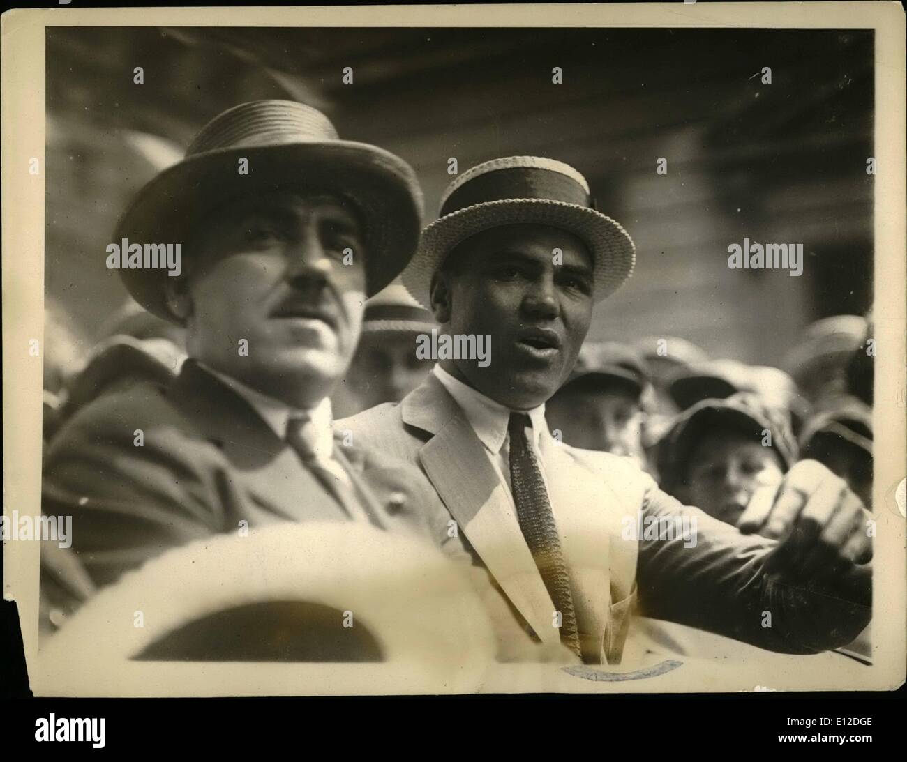 Dec. 15, 2011 - King of heavyweights visits Boston. Photo shows Jack Dempsey, heavyweight champion of the world, with acting Mayor David J. Brickley of Boston in Jack's car in front of City Hall, Boston, Mass., where the heavyweight title holder is visiting friends. Stock Photo