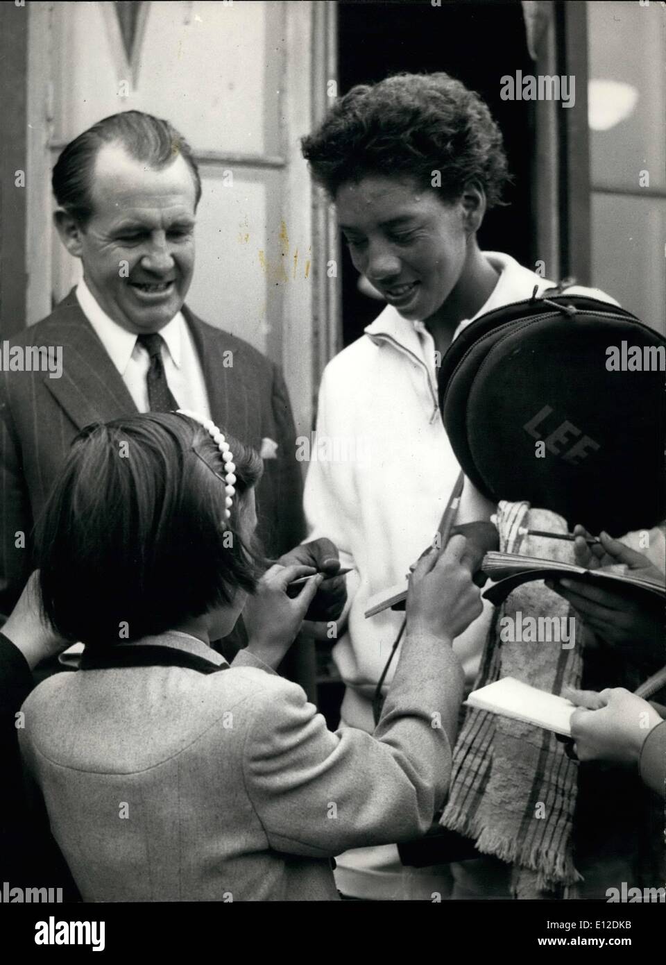 Dec. 19, 2011 - Young fans at Surbiton surge round Althea Gibson to get her autograph after he had reached the semi-finals at Surbiton. Stock Photo