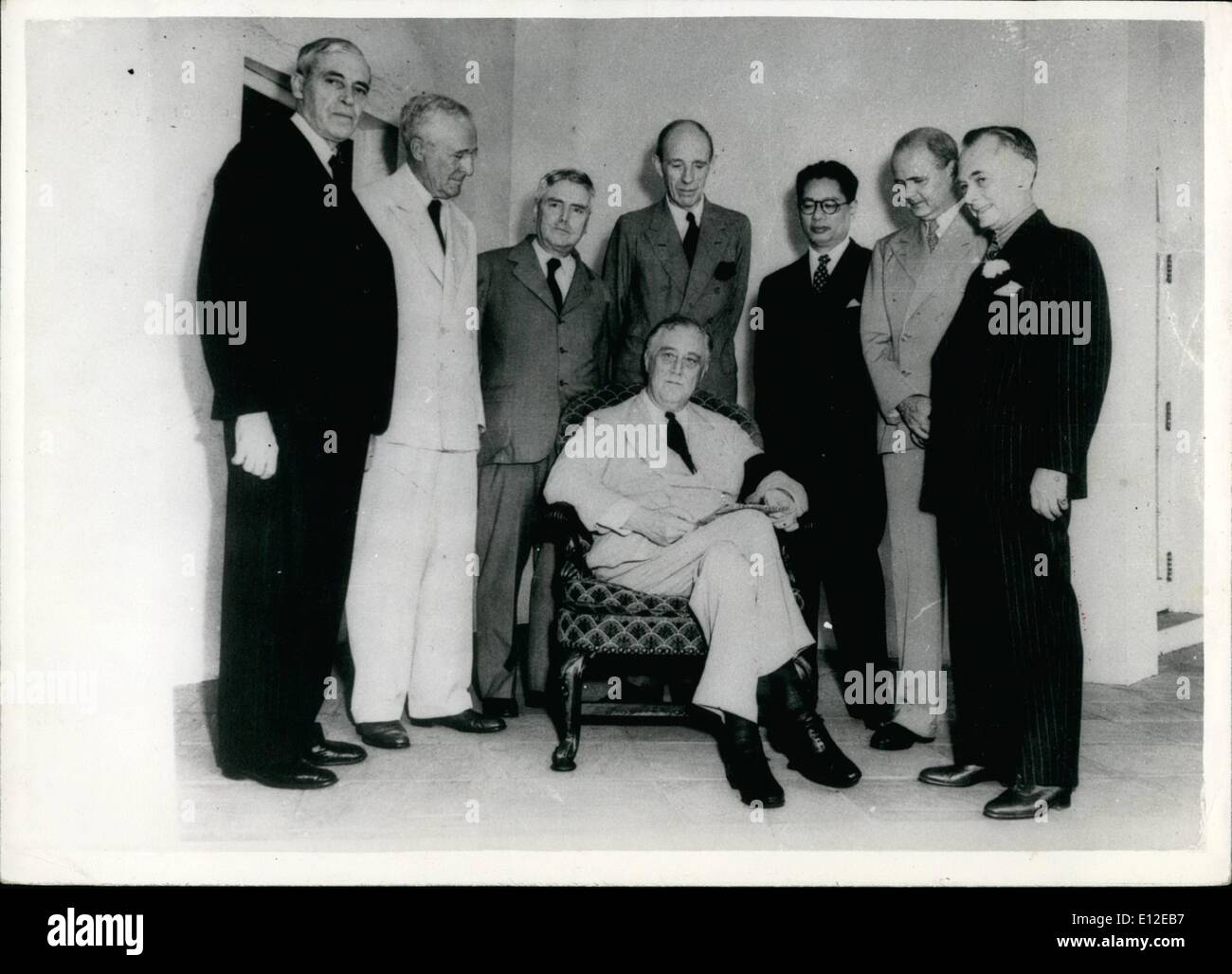 Dec. 16, 2011 - President and Pacific was council: Photo shows President Roosevelt, seen seated as members of the Pacific War Council stand rounf in a group at the White House. The Pacific War Council , is held a ''Round the World'' Conference, which included particular exploration of the situation in China and India and their ''Relationship to Japan''. The group (L to R). Sir Owen Dixon, of Australia; Leighton McCarthy, of Canada; Walter Nash of New Zealand; Lord Halifax, Dr. T.V. Soong, of China; Dr. A Stock Photo