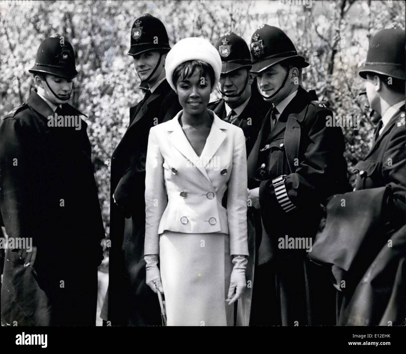 Dec. 16, 2011 - Diahann diverts the law.: A squad of policemen were assembling in London's Embankment Gardens yesterday, preparing to go on duty in Trafalgar Square for London's May Day rally, when along came a sight that completely diverted their attention it was beautiful dusky jazz singe Diahann Carroll who was the star of the Broadway musical ''No Strings'', and who has come to London to star in a show on BBC-2. A soon as Diahann appeared, the policemen soon forgot about their May Day Rally job, for the girl who has been hailed as greater than Lena Horne. Stock Photo
