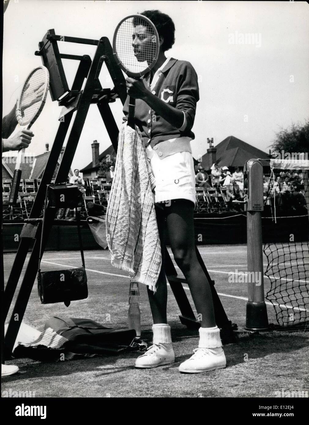 Dec. 21, 2011 - Althea Gibson wipes the hands of her racket before her match at Sauritch. Stock Photo