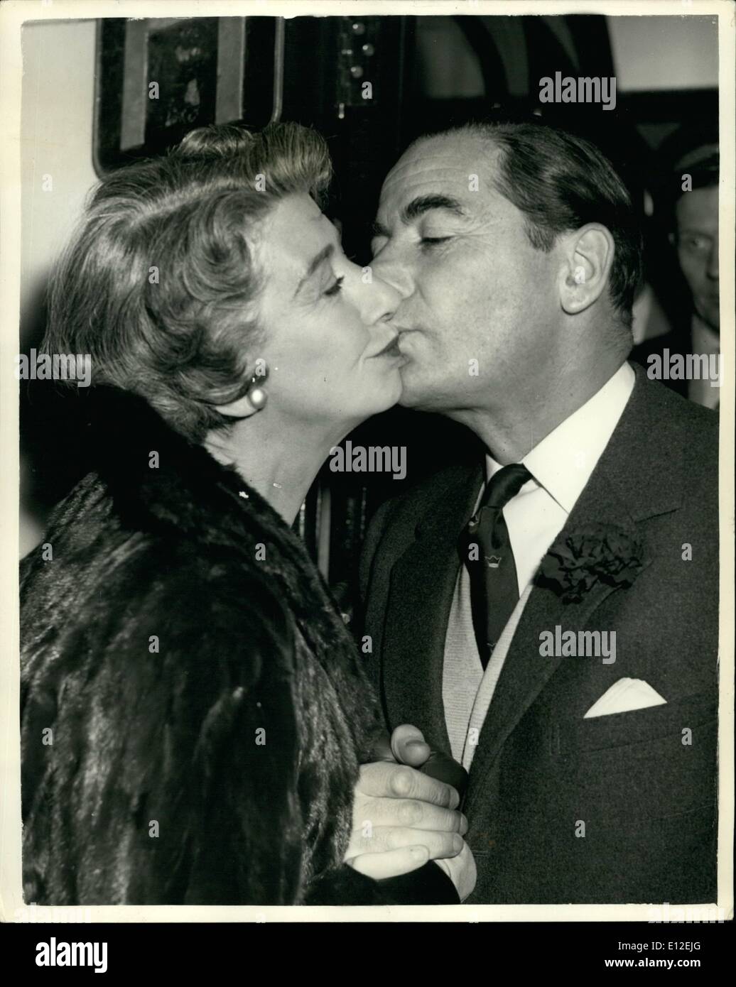 Dec. 21, 2011 - hoto Shows:- The Famous Film actor, Lho Genn is Kissed Goodbye by his wife, when he left Waterloo this Stock Photo