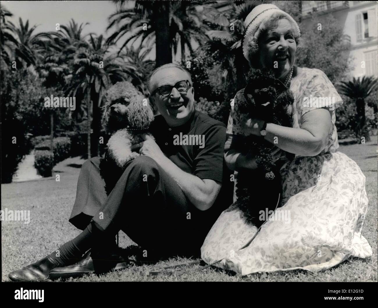 Dec. 26, 2011 - Harold Lloyd in Cannes - Harold Llyoyd Famous Coemdian of the Silent Movies is spending his Summer Vacations with his family in Cannes. OPS Harold LLoyd and His wife Mildred in Cannes with their pet-poodles ''Pierre'' and Peppi' Stock Photo