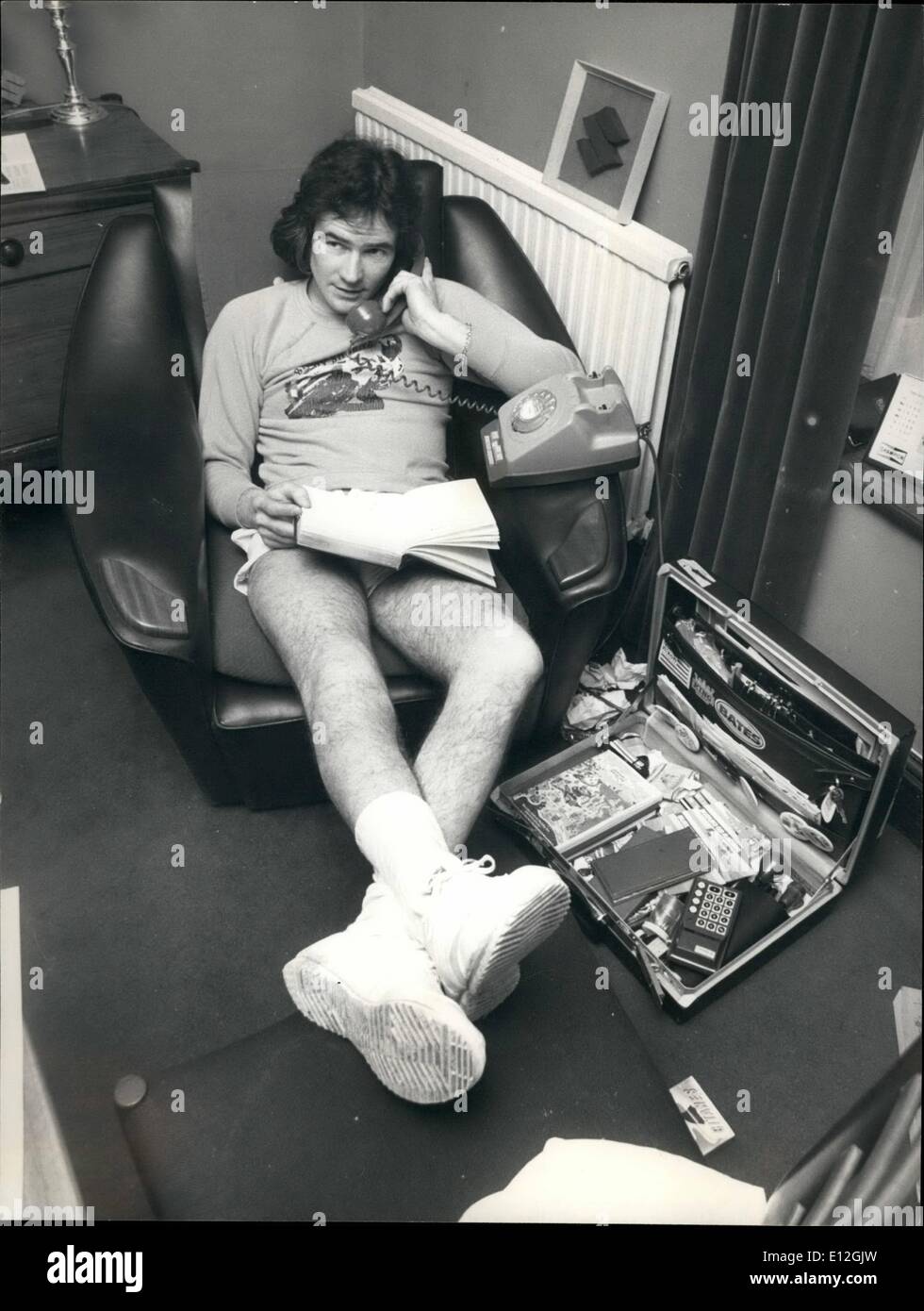 Dec. 29, 2011 - Keeping in touch with the outside world! Barry Sheene relaxing after a tough day of training at his country mansion home in Wisbech, Cambridgeshire. Stock Photo