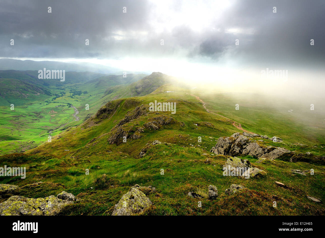 Sunlight and clouds on the Langdales Stock Photo