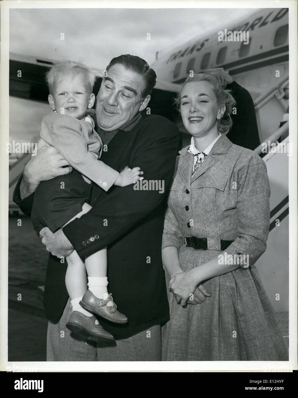 Feb. 24, 2012 - Idlewild Airport, N.Y., May 21 -- Actor Paul Douglas meets his wife and son, Adams, after their arrival here this morning via TWA Ambassador flight from Los Angeles. Mrs. Douglas is actress Jan Sterling. Stock Photo