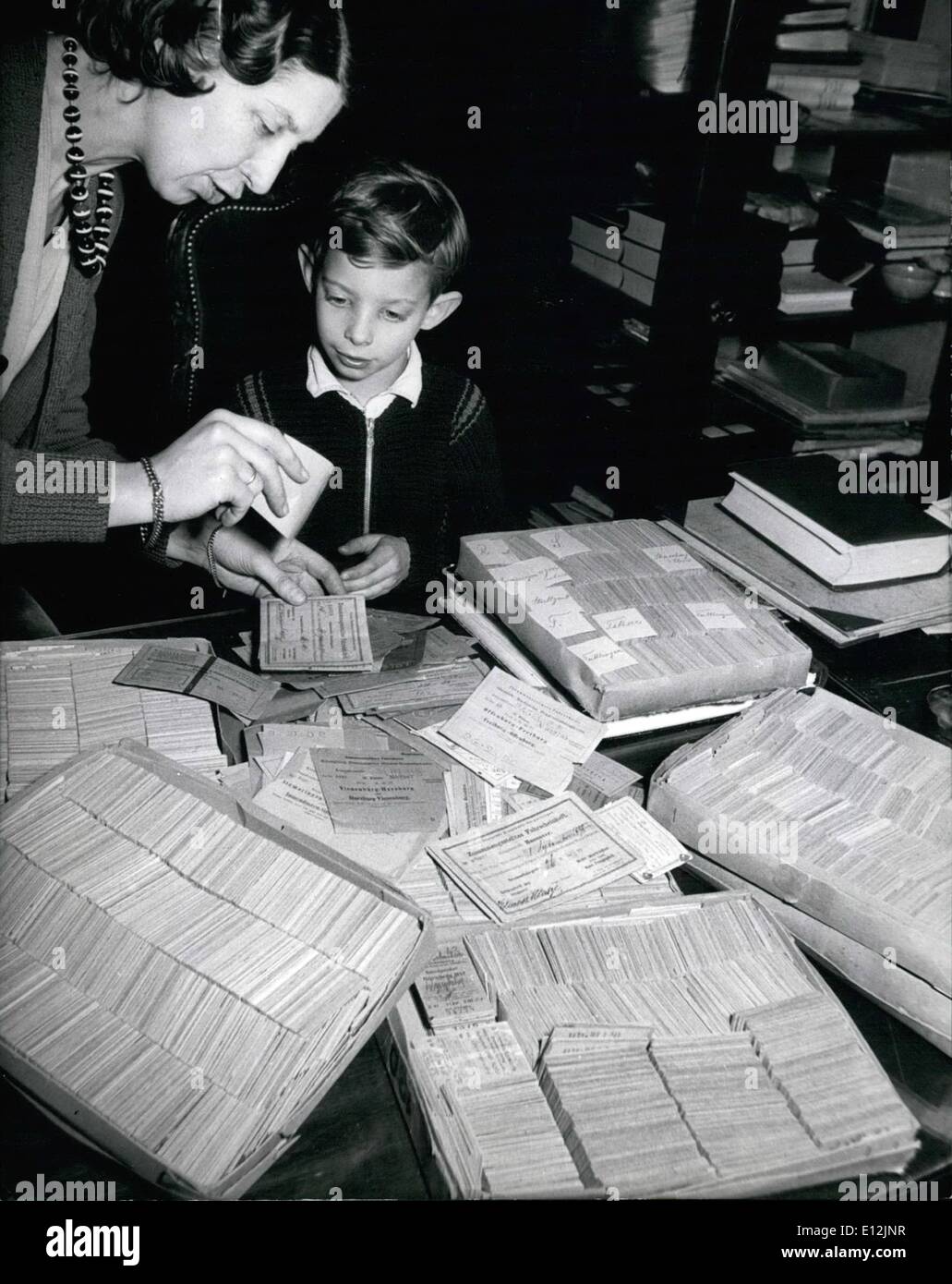 Feb. 24, 2012 - His hobby are railway tickets. 8 year old pupiel Anhard Klein from Nuremberg Germany is collecting railway tickets. Here he is seen classifying the tickets. He just got 7,000 ones from his father who collected them since 50 years. Anhard is very proud to have a ticket dated from 1835 issued by the railway administration of Konig Ludwig Bahn , first German railway ligne. Keystone pict from Feb. 26th, 57 Stock Photo