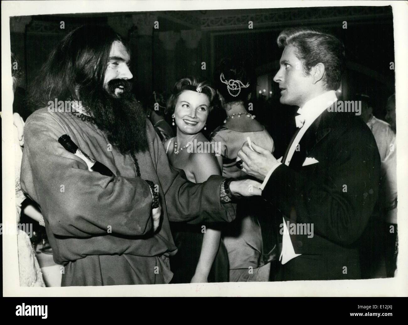 Feb. 24, 2012 - Filming ''The Rasputin's Nights'' - In Rome: The new film ''The Rasputin's Nights'' - is now being made in the Cinecitta studios in Rome - with Edmund Purdom as Rasputin - John Barrymore JNR. as Prince Yussopov and Jamy Clair as his wife. Photo shows Edmund Purdom as Rasputin - and John Barrymore JR, as Prince Yusapov - during the filming in a ''night club of the Nicholas II'' Era, in Sst. Petersburg. Stock Photo