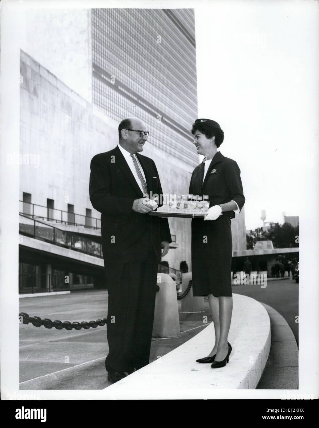 Feb. 24, 2012 - For Release Sunday, Oct. 23, Or Thereafter: U.S. Ambassador James J. Wadsworth accepts a piece United nations''birthday cake'' from Trans World Airlines hostess Ann Lennon outside U.N. headquarters in New York. Similar pieces of pastry, frosted in white with blue''U.N.'' initials and decorated with miniature U.N. flags, will be served to passengers on TWA flights Oct. 24, in observance of United Nations Day. miss Lennon is from New Hyde Park, Long island. Stock Photo