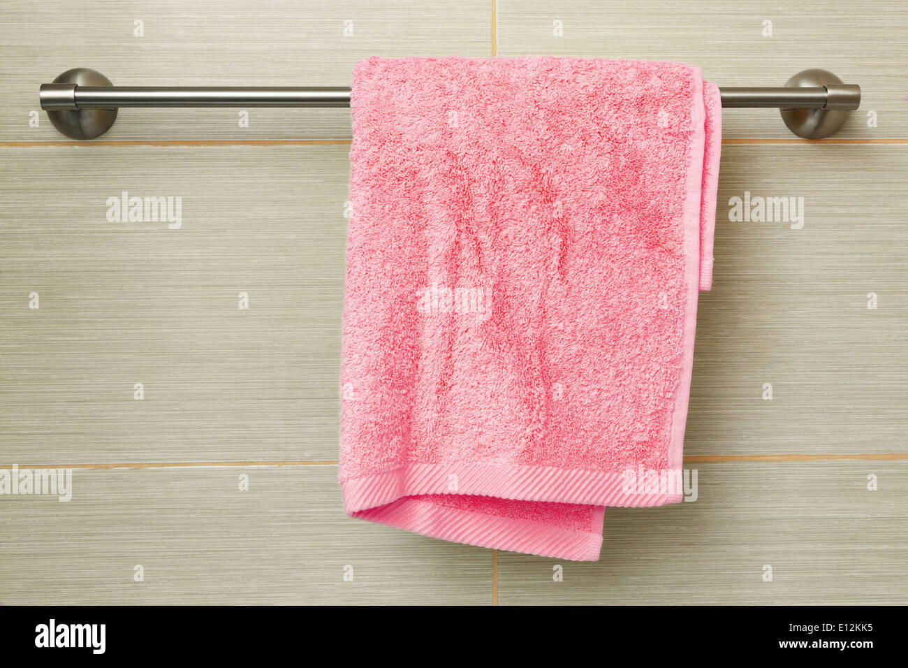 yellow towel on the wall in the bathroom Stock Photo Alamy