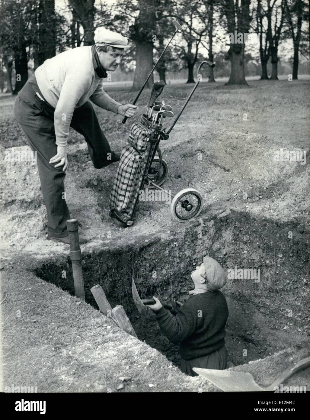 Feb. 24, 2012 - ''Didn't Think it Went That Deep, Charlie...'' Gold balls are expensive these days, and rather than lose one, Charlie decides to dig for for it. Stock Photo