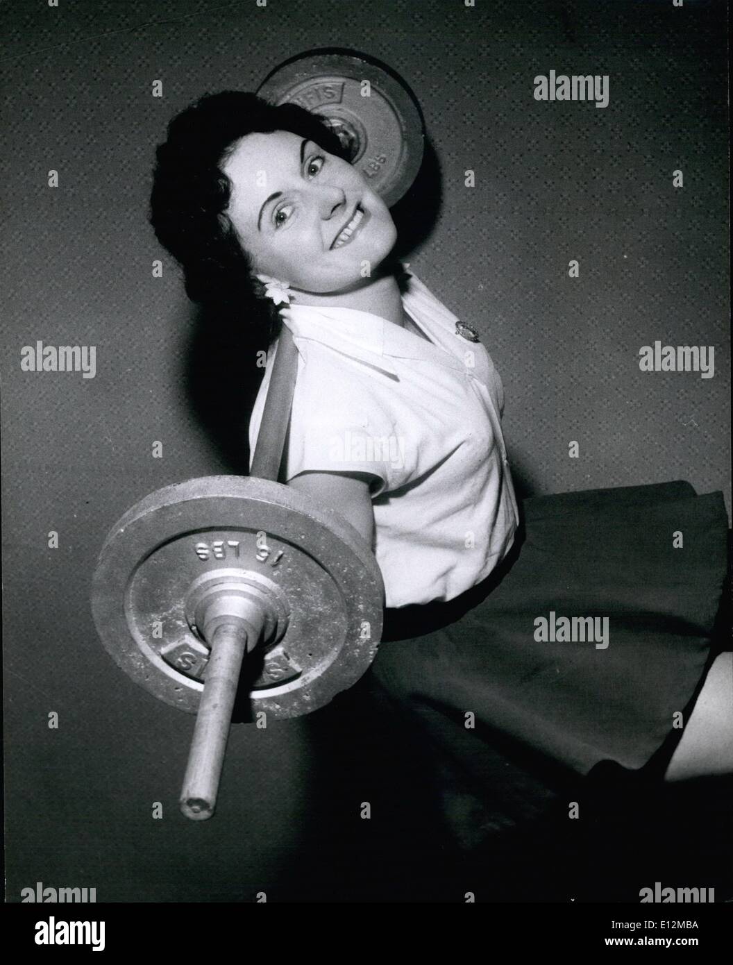 Feb. 24, 2012 - Judging by Mrs. Jean Leamey' happy smile lifting weights seems to be the easiest thing in the world. Here she lifts a 30 lbs barbell. During this every morning helped to cure her asthma. Stock Photo