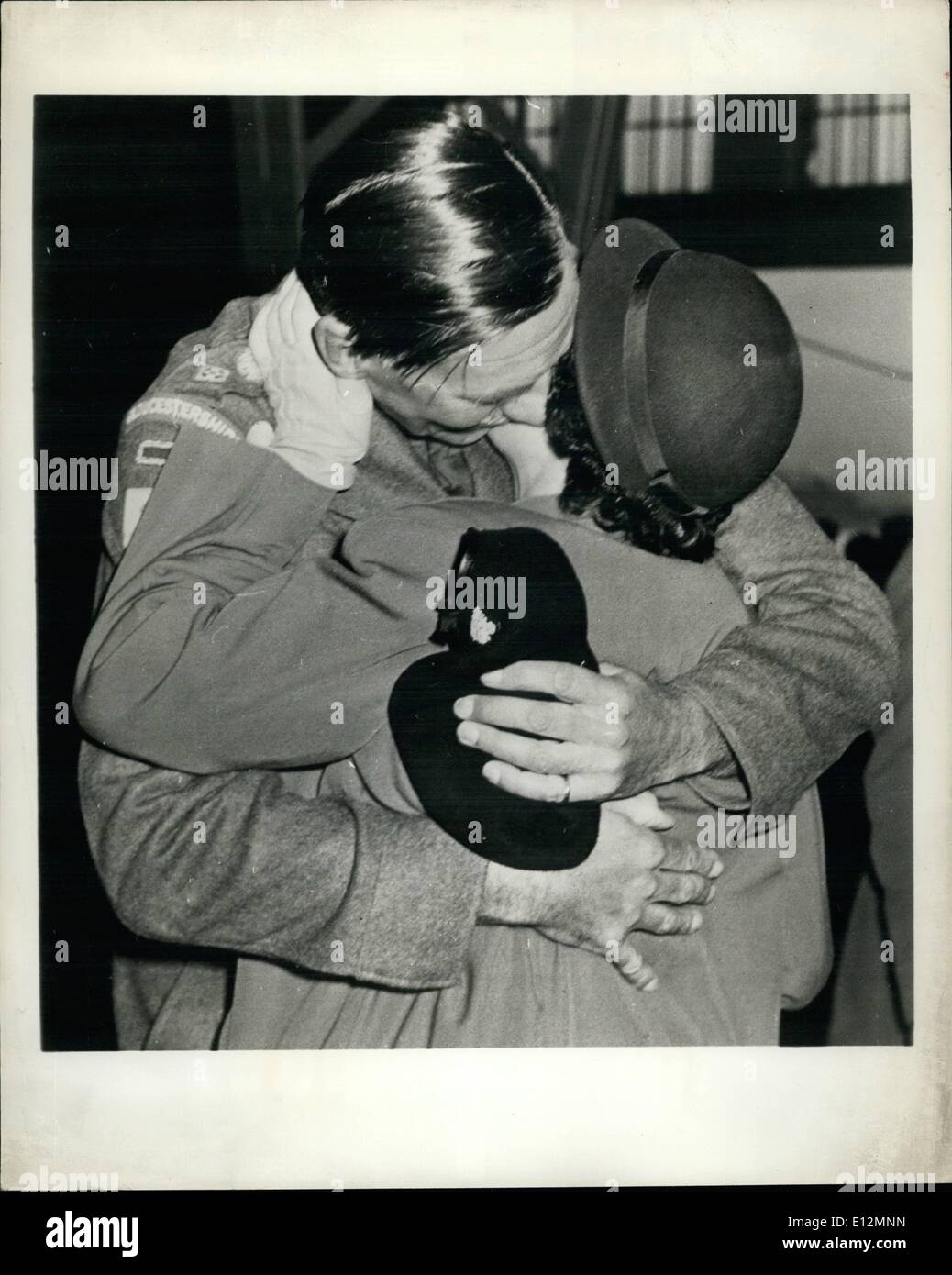 Feb. 24, 2012 - Heroic Commander's Homecoming from Korea Prison: Included in a recent group of 150 released British prisoners of war to arrive home was Lt. Col. J.P. Carneo, Commander of the 1st Battalion, Gloucestershire Regiment In their heroic saving of the U.N. line on the Imjin in April, 1951. then, at the end of the battalion's four-day stand, the time came for withdrawal, Colonel Carne gave his men permission to fight their way out independently while he stay behind with the wounded and was captured. Photo shows - Lt. Col. Carne is greeted by his wife on land at Southampton, England. Stock Photo