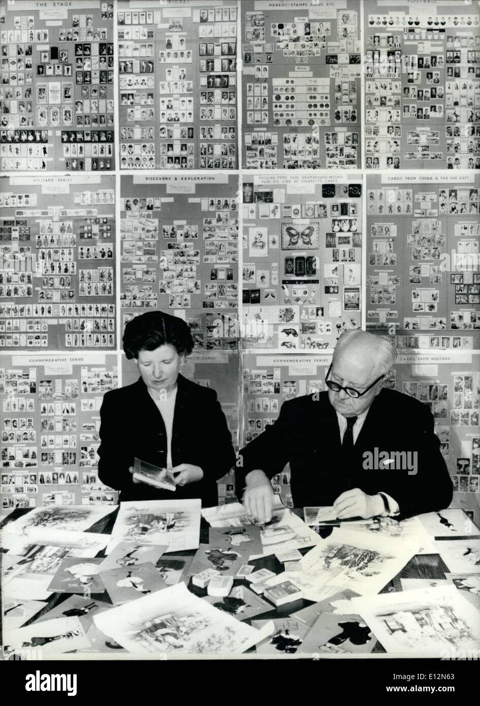 Feb. 24, 2012 - The Colonel who is a Ã¢â‚¬ËœKing' of Cigarette Cards. Colonel Bagnall and his daughter Dorothy sorting some of the vast collection of cigarette cards. Behind them are some of the cards on which series are mounted. Stock Photo