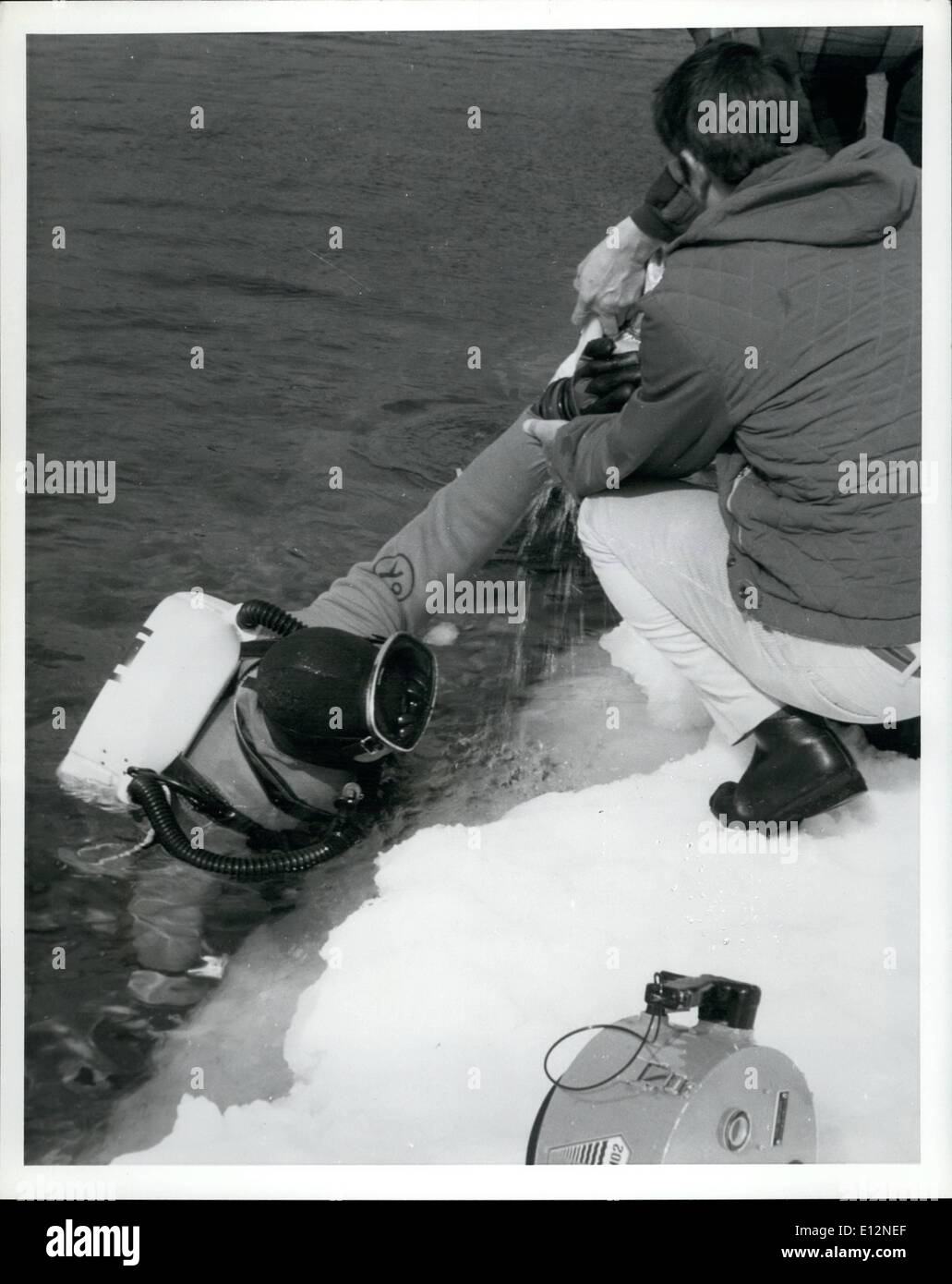 Feb. 24, 2012 - Diver surfaces in frigid waters following test of a closed-cycle breathing device developed by Oceans System Programs of General Electric's Re-entry and Environmental Systems Division, Philadelphia. Unlike conventional SCUBA equipment which had freezing problems the closed-cycle system ''performed perfectly'' the company said. Stock Photo