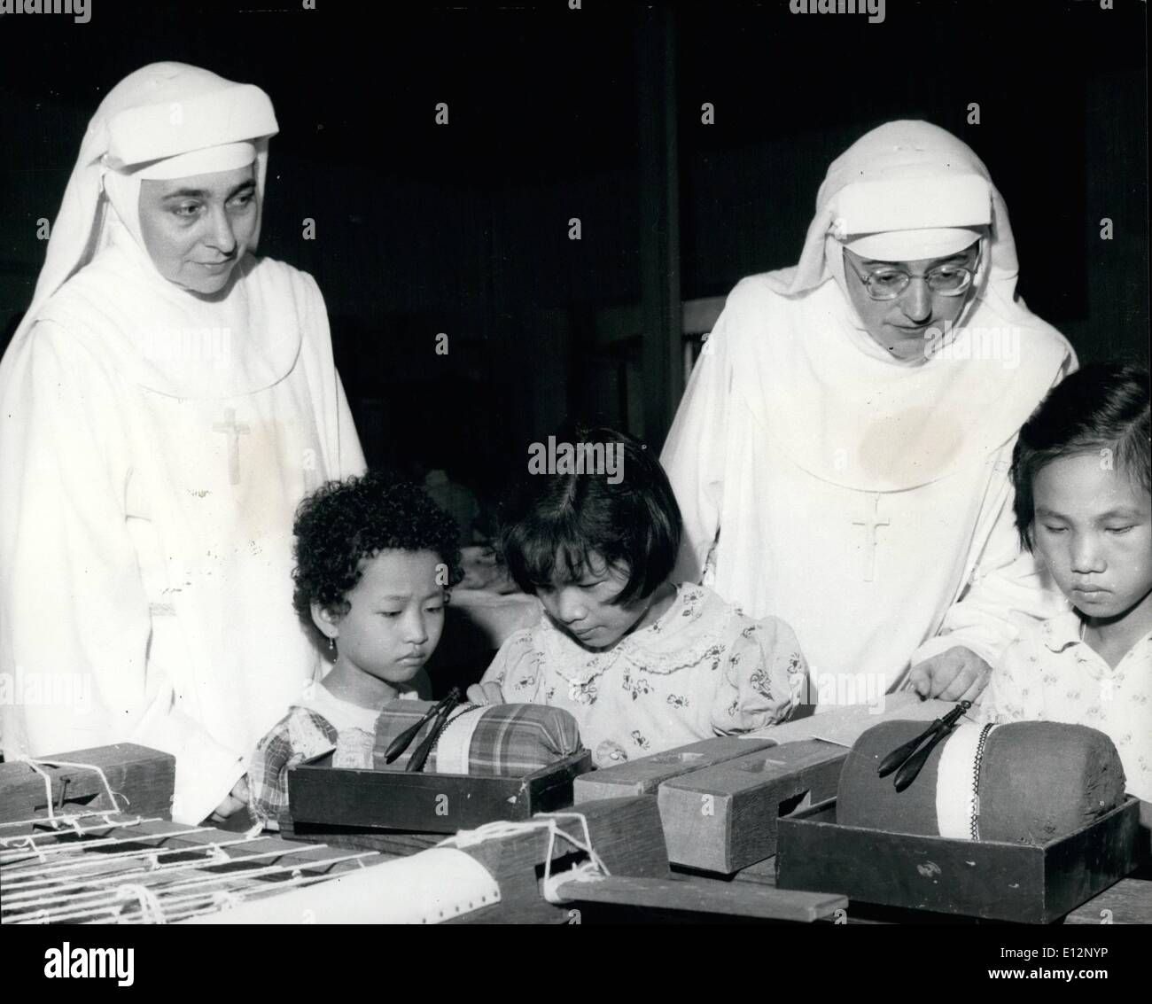 Feb. 24, 2012 - Education in this predominantly Catholic Portuguese settlements is in the hands of the Church. The Girl's convent school is staffed by Portuguese nuns. Picture shows two nuns supervising a handicraft lesson. Stock Photo