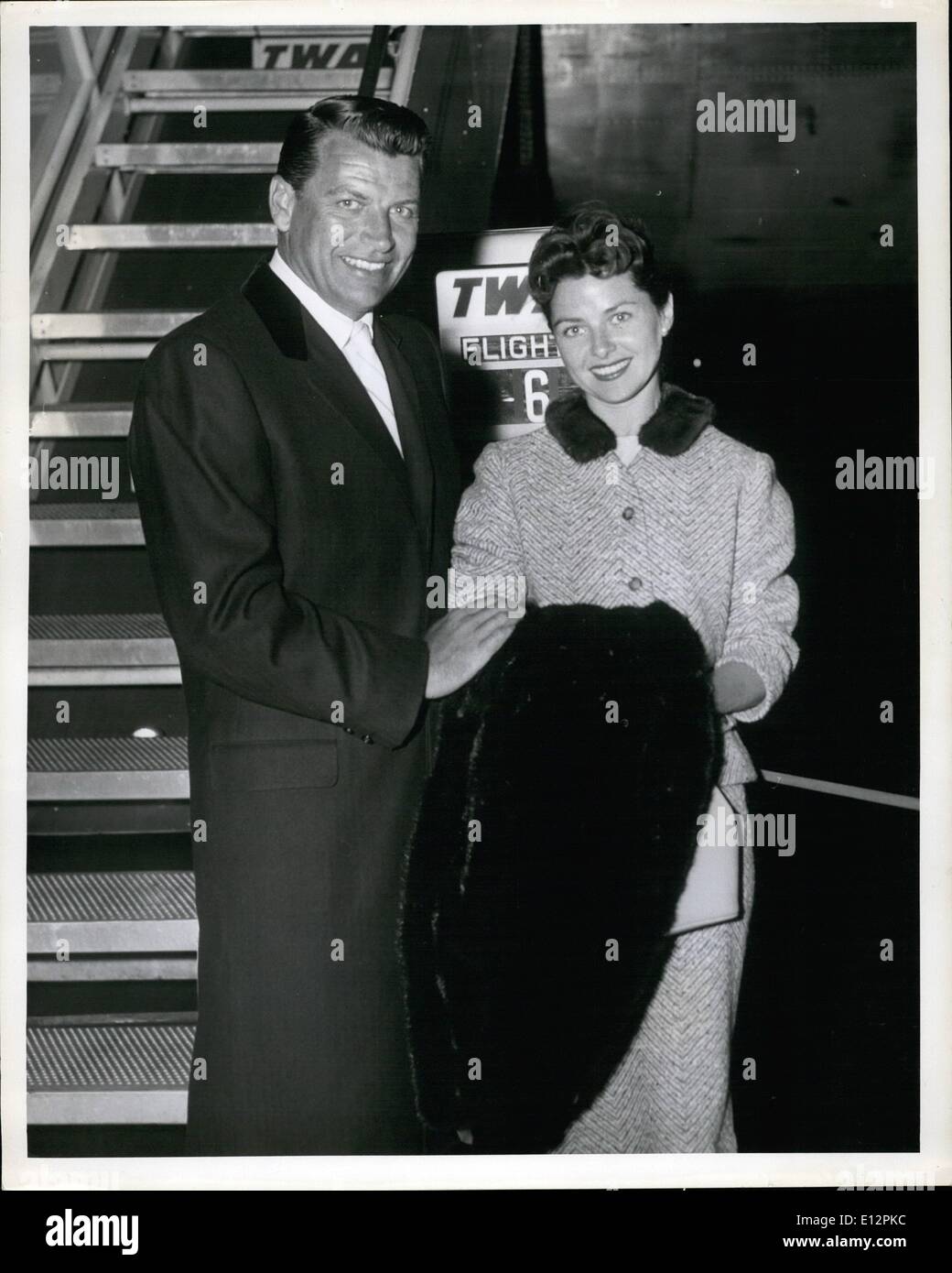 Feb. 24, 2012 - New York International Airport, May 6: Movie actor, Richard Egan and his lovely wife arrived here for a two-weeks vacation trip following the completion of a new motion picture. They flew in from Hollywood on TWA's non-stop Boeing 707 Jet. Stock Photo