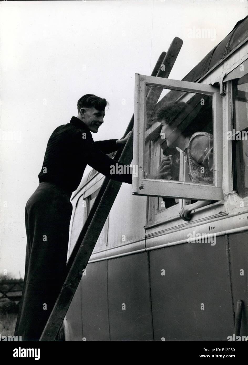 Feb. 25, 2012 - NEWLYWED LIFE-IN A BUS. there are plenty of windows to keep clean in a bus. Gilbert regularly cleans them for his wife, will lends encourage with a smile. Stock Photo