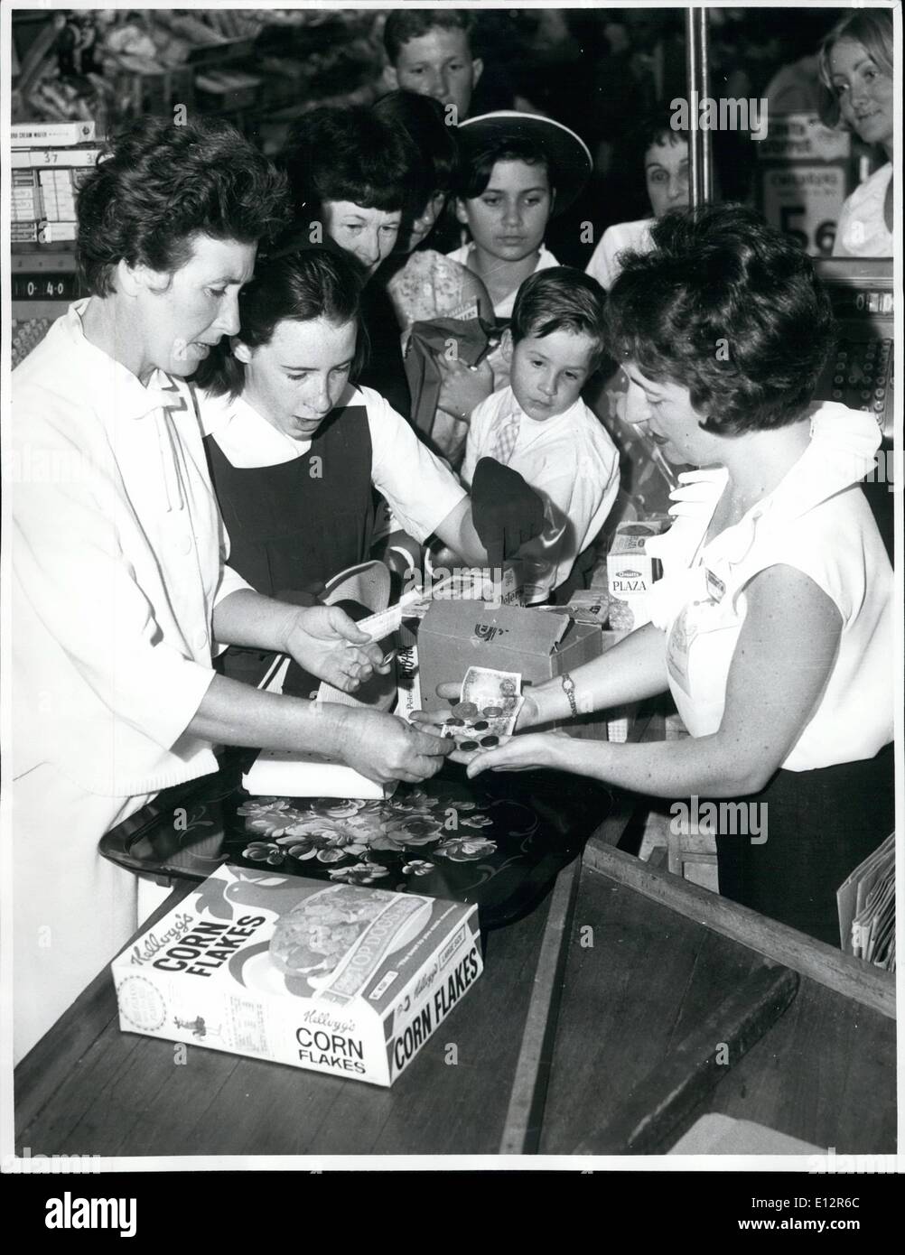 Feb. 25, 2012 - Decimal currency in Australia ; A major event in Australia in February, 1966, was the change-over to decimal currency. picture above shows Shoppers in a Sydney store making purchases in mixed pounds, shillings and pence and decimal currency. Stock Photo