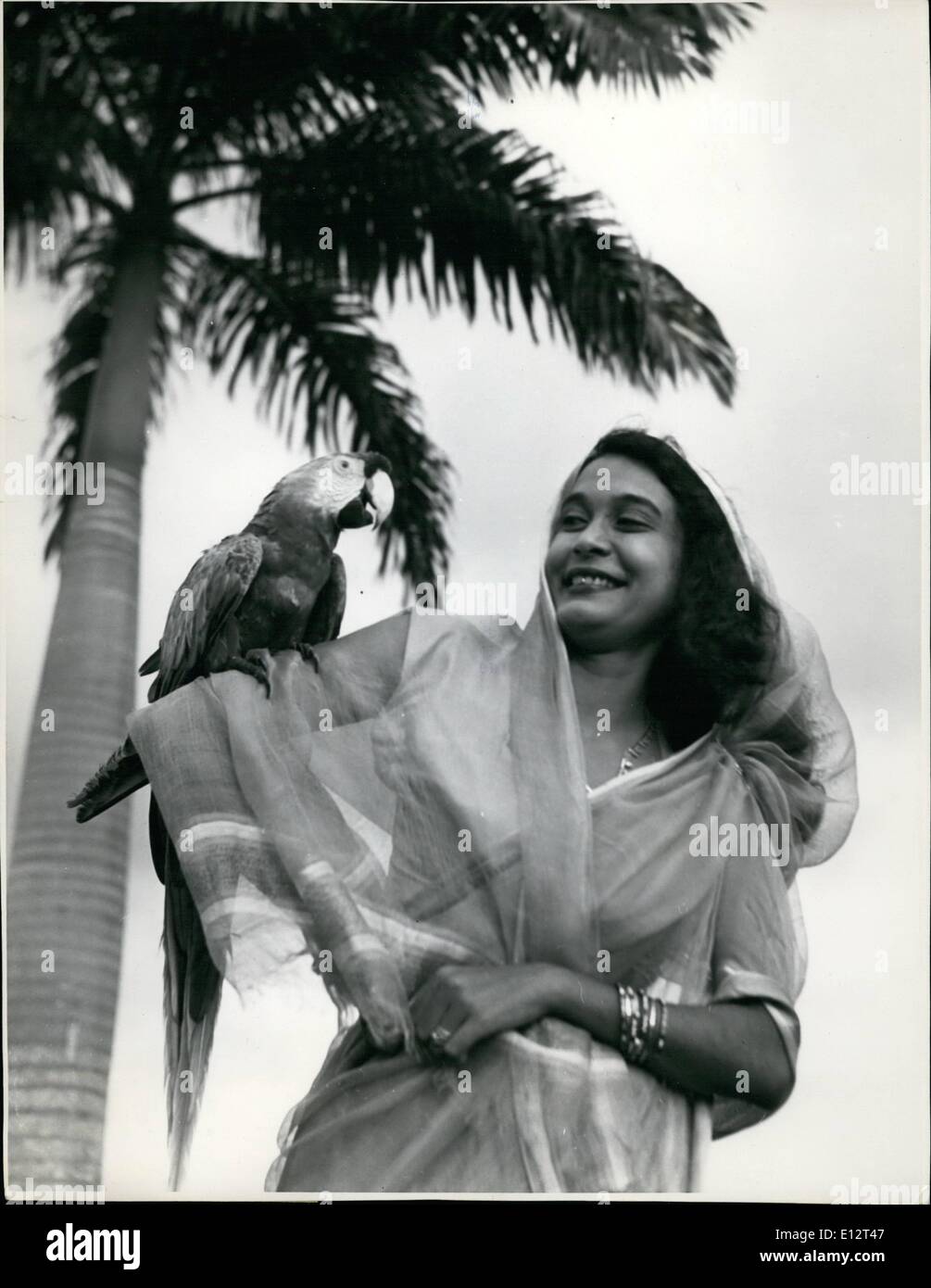 Feb. 25, 2012 - Bird And Beauty. East Indian Girl And Macaw Trinidad, B.W.I. .co Stock Photo