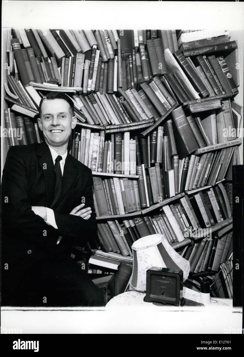 Feb. 25, 2012 - The man whose life is devoted to the deaf. Dennis Uttley with some of his books. His savings have been spent on helping deaf children, and there has been none left over for a bookcase. Stock Photo