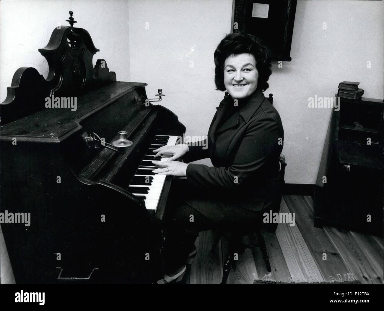 Feb. 24, 2012 - Famous concert singer Birgit Nilson has returned back to Sweden for vacation. So she does every year. To this yearly routine belongs another thing, too. As the local folk needs a lot of money to restore old, unique buildings there has been a tradition since many years that British Nilson gives two concerts in a church close to that house where she has grown up. She isn't payed for this singing. The picture shows British Nilson trying to play that organ on which she tried to play as a child Stock Photo