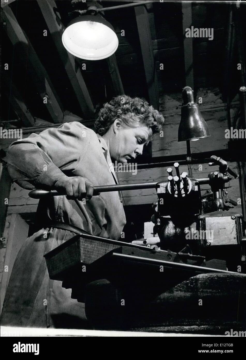 Feb. 25, 2012 - Women As Engineers: Miss Farris Is An Expert With A Lathe: Miss Farris, having fixed the jigs herself, now operates a centre lathe in the Gillingham factory which is run and staffed entirely by women engineers. Stock Photo