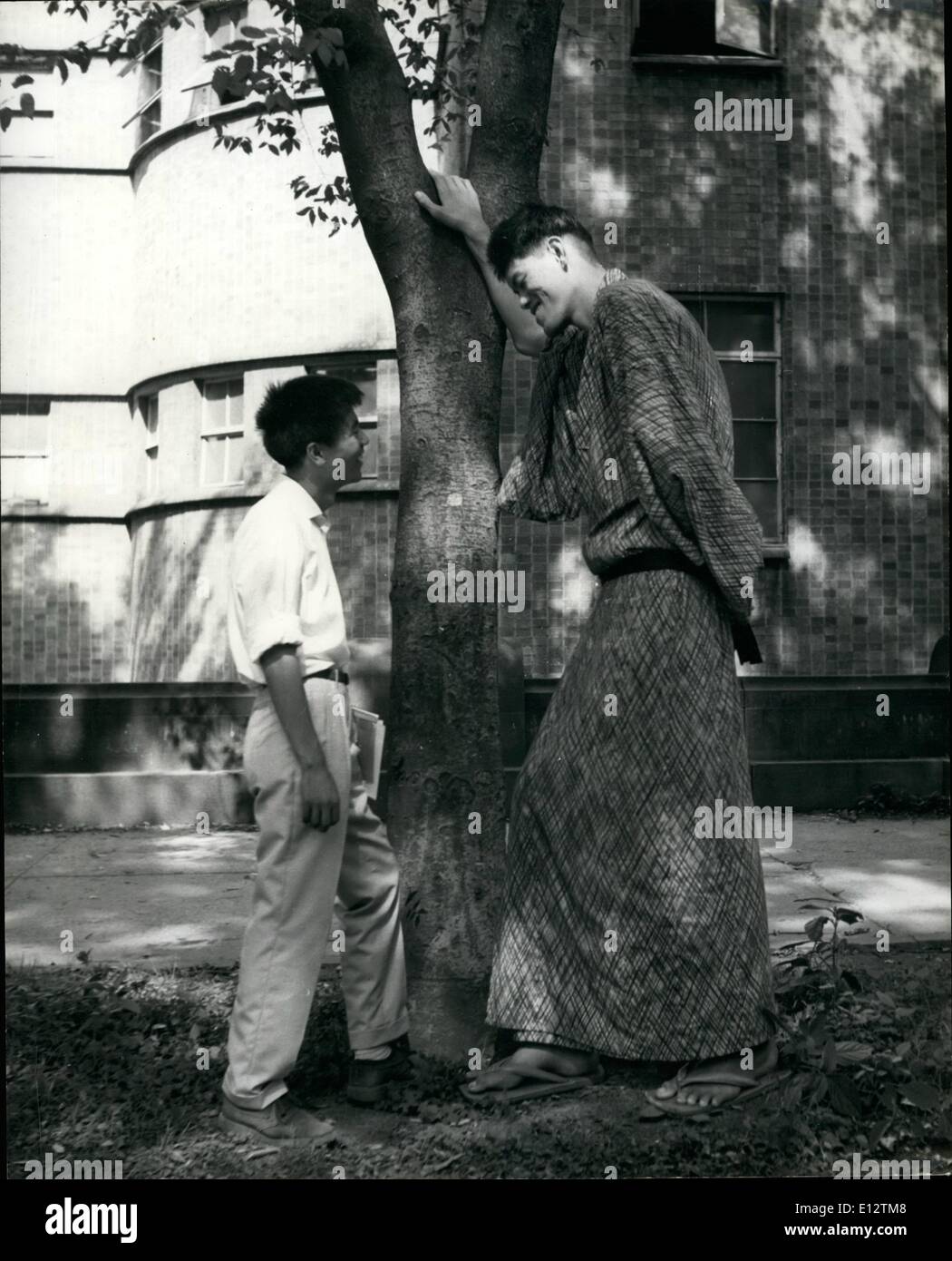 Feb. 24, 2012 - The giant Yoshimitsu talks with a normal size Japanese man in the grounds of the hospital. Stock Photo