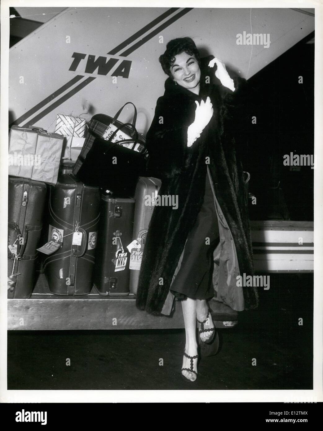 Feb. 24, 2012 - Songbird Marion Marlowe, loaded down with Christmas presents, prepares to board a TWA plane here today for St. Louis, to spend Christmas at home. Credits: TWA Stock Photo