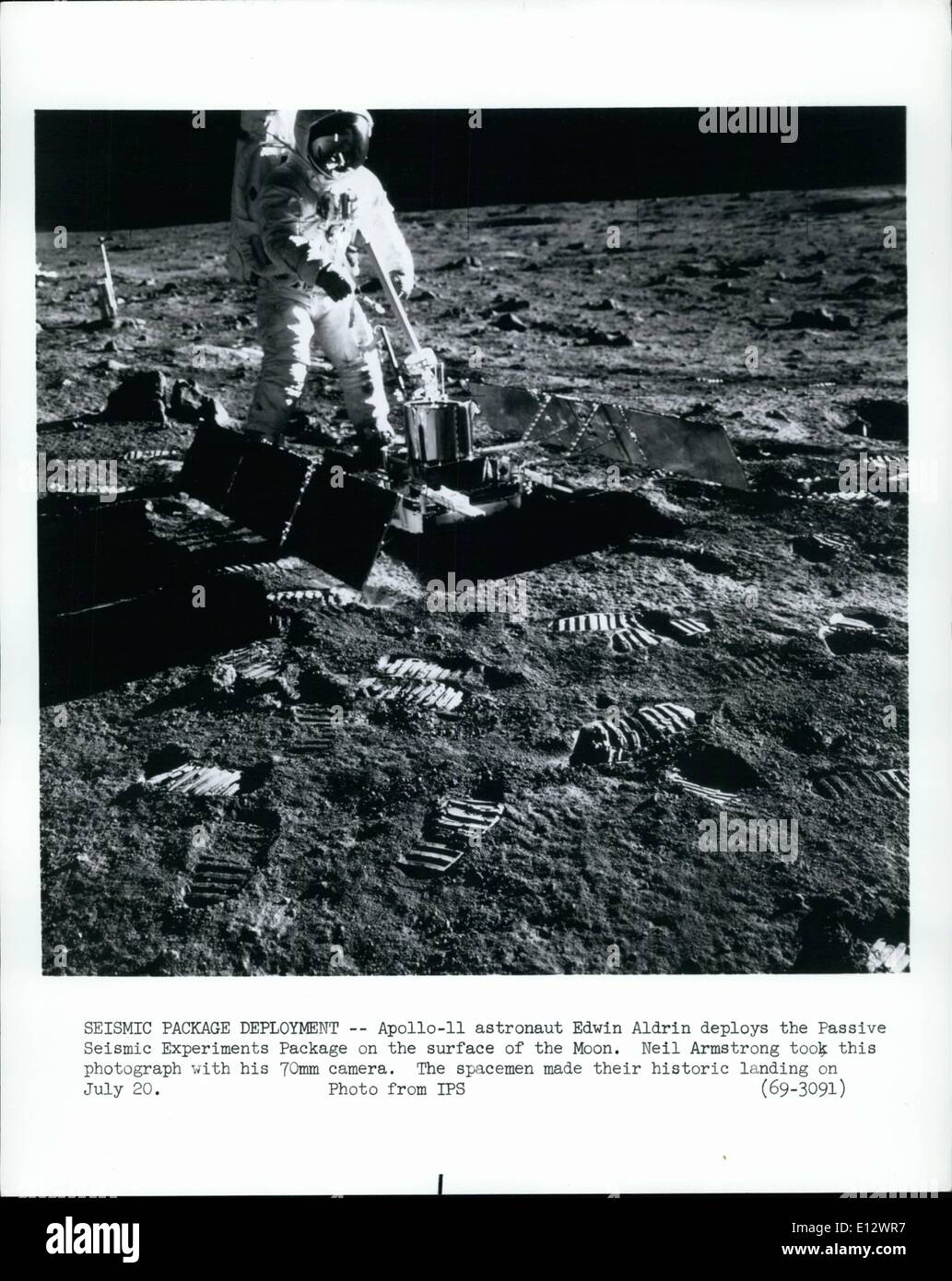 Feb. 26, 2012 - Seismic Package Deployment - Apollo-11 astronaut Edwin Aldrin deploys the Passive Seismic Experiments Package on the surface of the Moon. Neil Armstrong took this photograph with his 70mm camera. The space made their historic landing on July 20. Stock Photo