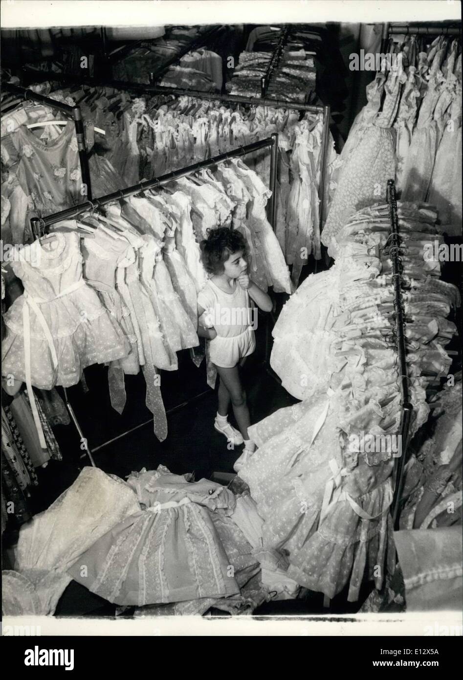 Feb. 26, 2012 - Little girl is a whirl Annette Patterson is surrounded by dresses, she doesn't know where to start trying them on. Stock Photo