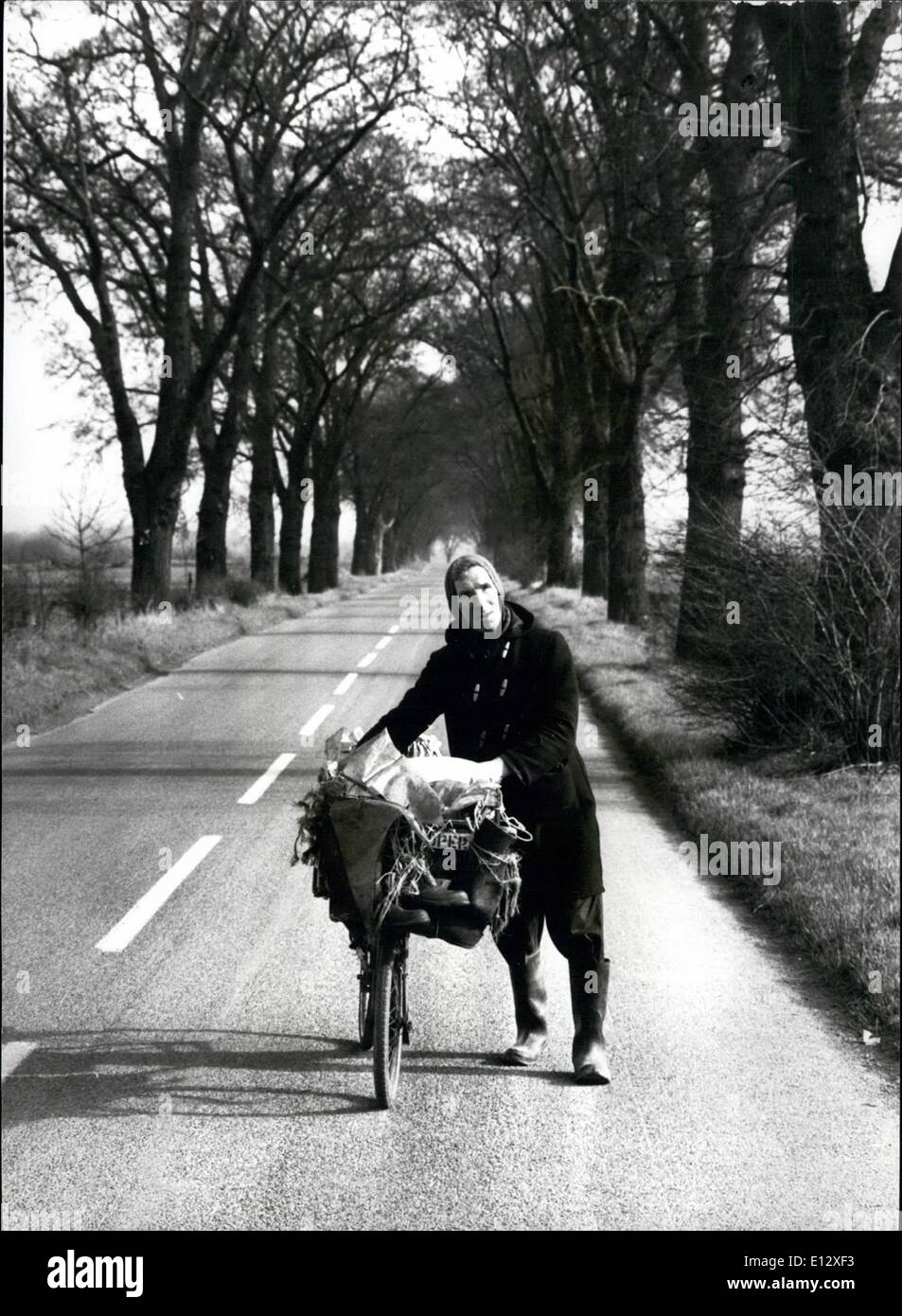 Feb. 25, 2012 - The long, straight road ahead-that's ow 62 year old Alan Barker seems it as he goes about the 20 mile a day newspaper round that he has been doing for 34 years. Stock Photo