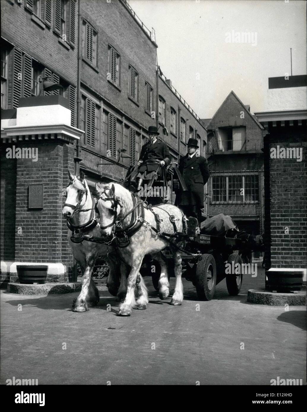 Feb. 25, 2012 - Royal and Sovereign At their regular job of pulling the Brewer's dray. Driver Charles Strickland has the reins and Trouncer Charles Gibbons stands behind as they leave the Brewery to deliver supplies. Brewer's Horses Will Take The Speaker To The Abbey For The Coronation: One of the oldest and most colourful coaches to be seen in the Coronation procession will be The Speaker's Coach, which is so heavy that it requires brewer's dray horses to pull it Stock Photo