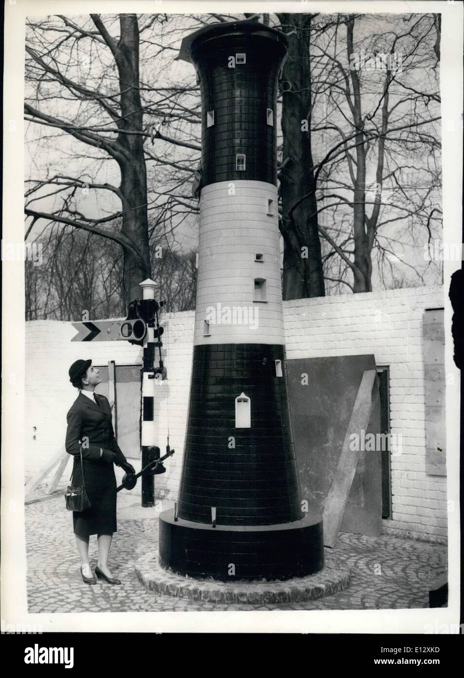 Feb. 26, 2012 - Belgium Prepares For The International Fair.. Lighthouse Model In British Pavilion.. Preparations are well ahead for the opening in Brussels - of the great International Fair. Keystone Photo Shows:- In the ''Courtyard of Invention'' of the Great Britain Pavilion - planned by the Royal College - Nineteen year old Miss Vee van Parys of Antwerp looks at a model of a lighthouse - at the exhibition.. Miss Van Parys wears the official uniform of a exhibition Hostess. Stock Photo