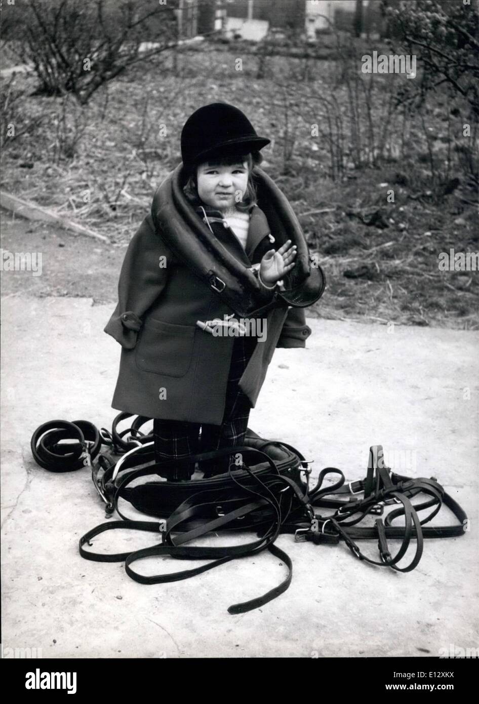 Feb. 26, 2012 - Velma Faulkner, 2-year-old rider, gets a trifle mixed up with her pony;s reins and dollar. Stock Photo