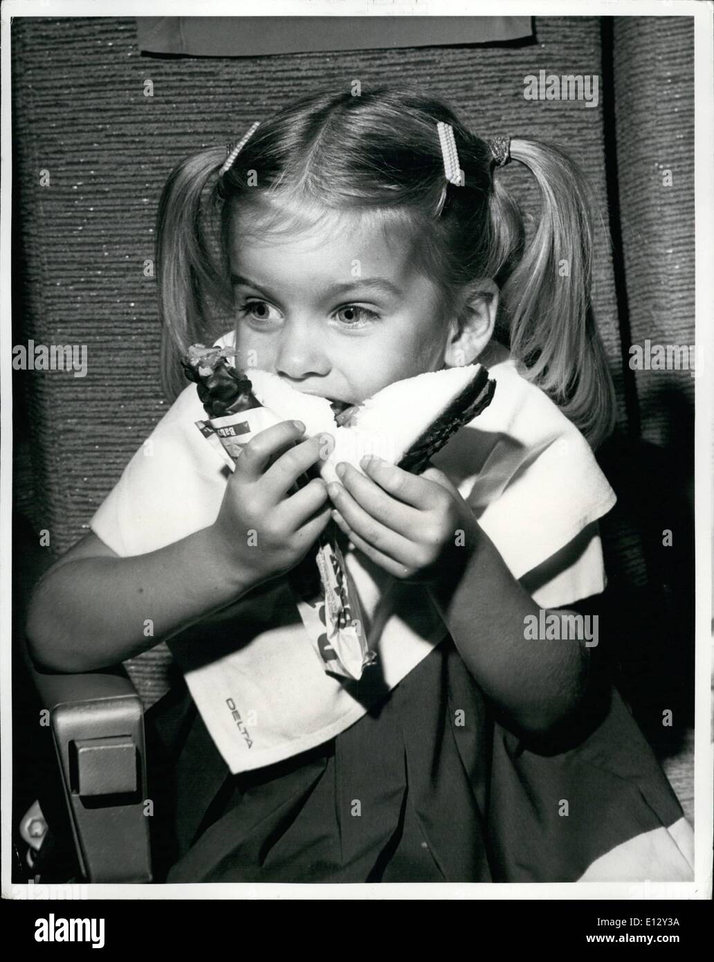 Feb. 26, 2012 - Fun Fare. Peanut butter sandwiches fly to prominence on jet flight menus that cater to the younger set. Three-year-old Penny Vaughan, of Fayetteville, Ga., registers hearty approval of Delta Air Lines' new policy of including sandwiches, Baby Ruth candy bars, and Funny Face drinks on Royal Service trans-continental flights, along with its usual adult-pleasing offerings of prime steak, lobster thermidor, roast duckling, and champagne. Stock Photo