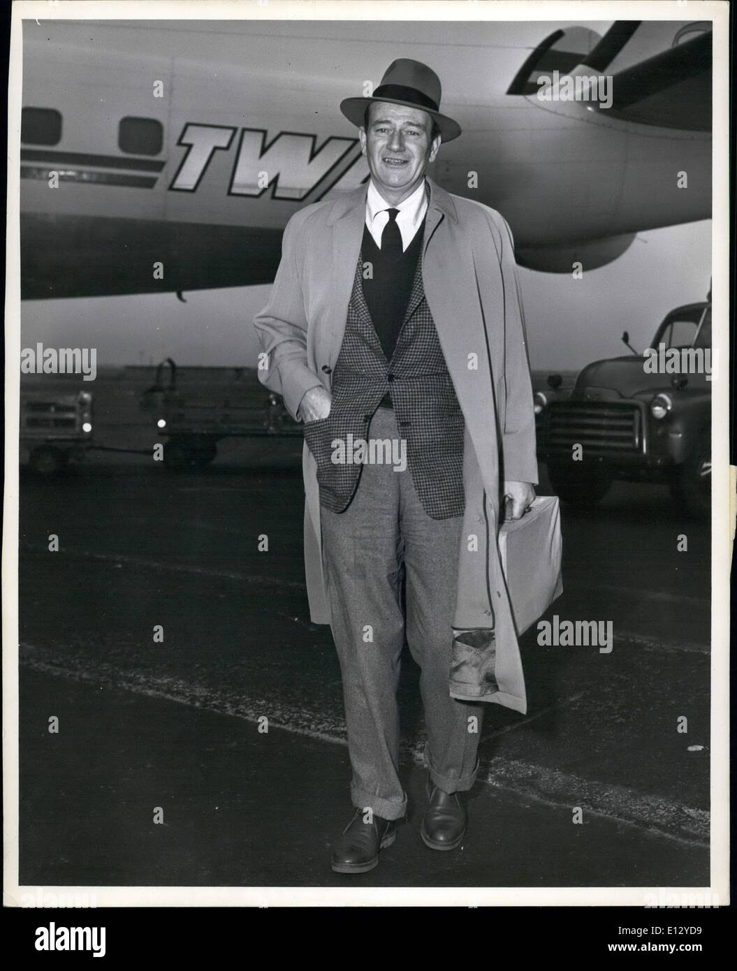 Feb. 26, 2012 - Popular Movie actor, john Wayne, steps Briskly Along after his arrival aboard a TWA super-g constellation from Paris. ''Duke'', as he is affectionately called, has just completed a European personal appearance tour promoting the movie ''The Conqueror'', an Rko film produced by Howard Hughes. Mr. Wayne Visited Rome, Berlin, London and Paris. He left Chicago by TWA shortly after his arrival. Stock Photo