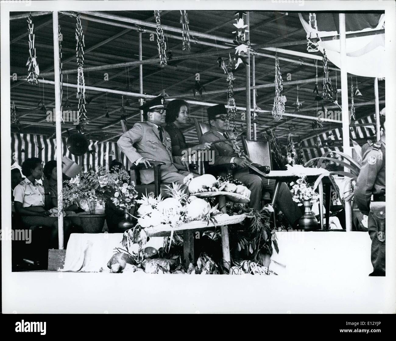 Feb. 25, 2012 - Sukarno, right, during ceremony laying cornerstone for new campus of Indonesian University, Djakarta, Indonesia, Sept. 26, 1965. Military aide center, fans Sukarno. Man on left in Uniform in Minister of Higher education B General (Ay) Professor Dr. Starif Thajeb (replaced on Feb. 22, 1966 by Dr. Johannes Leimena M   he is also Deputy Prime Minister II) Stock Photo