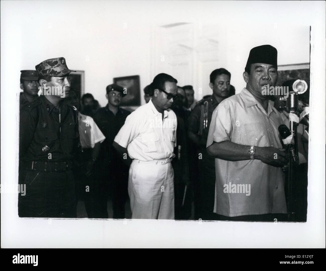 Feb. 25, 2012 - President Sukarno announces October 14, 1965 appointment of Maj. Gen. Suharto (left) as Army Chief. Suharto replaces Lt. gen Achamd Yani, who was killed by Communists in aborted coup of Oct. 1, 1965. In center is Dr. Subandrio, 1st Deputy Premier. Ceremony is at Istana Palace, Djakarta. Sukarno made a deal with the military (who routed the Somminists) to appoint Suharto providing that Subandrio stayed in the Cabinet (the military wanted Subandrio out). Behind Sukarno: his chief bodyguard, Brig Gen. Sabur-who was later ousted by Suharto on 3/29/66, and ultimately arrested Stock Photo