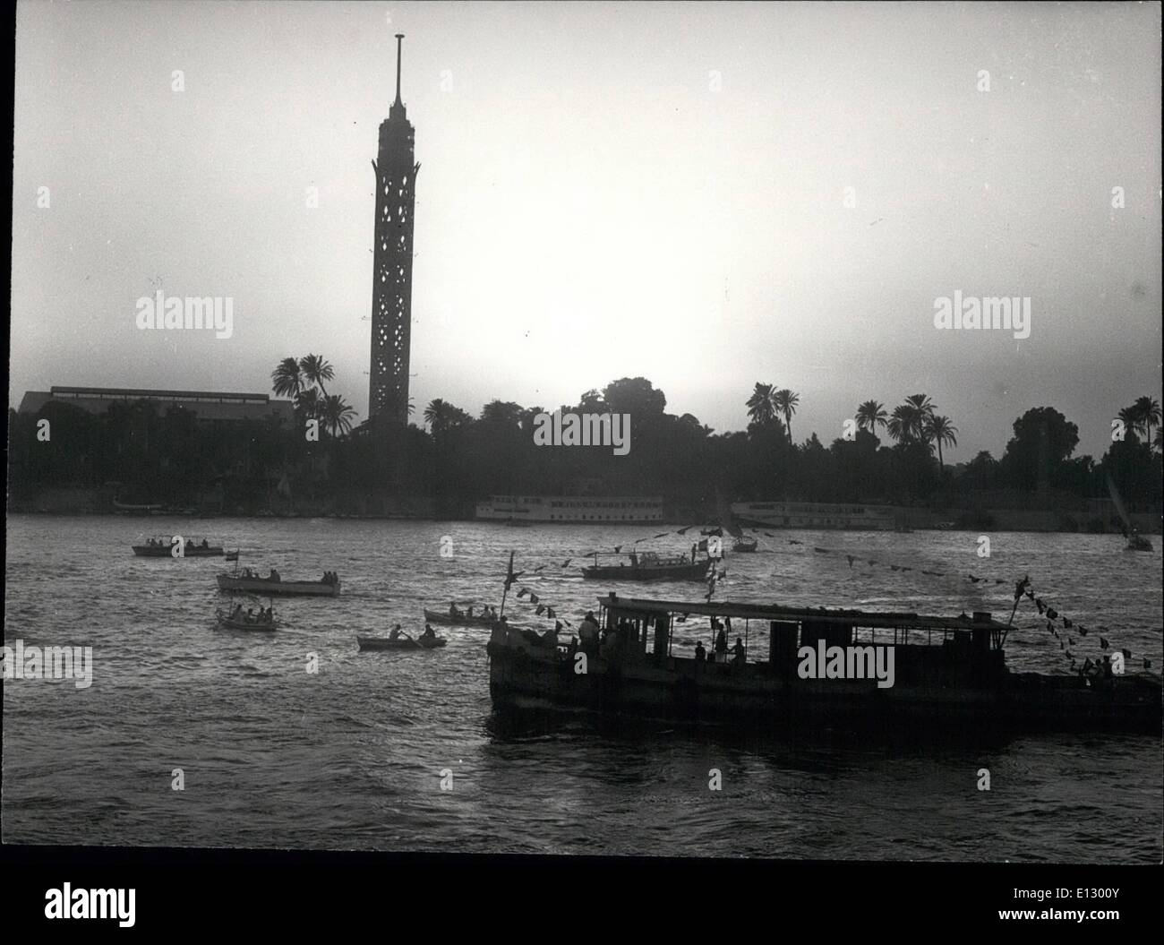 Feb. 25, 2012 - Wafa'a El Nil Ceremony (end of the inundation period) River boats procession sailing in the Nile. Guezira Tower is seen in the background. In old days, during the Pharonic ages, it was the custom to throw to the Nile a virgin as a sacrifice to the idolized river. With Islam, the brutal tradition was abolished and a dummy of a girl was used instead. Stock Photo