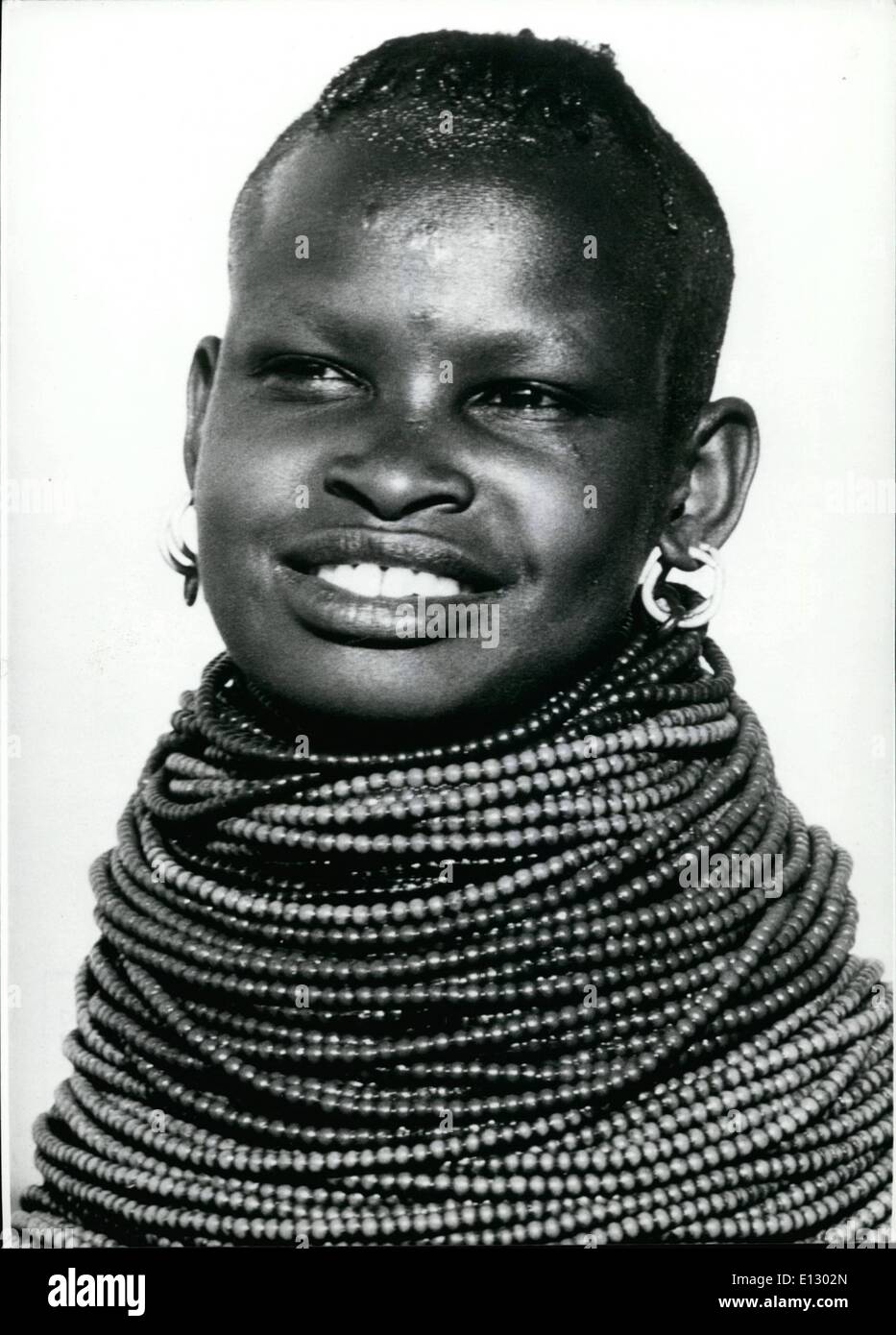 Feb. 25, 2012 - It was her own will: To be putted in irons. Surely there is a festivity, for it is profitable to be dressed in this way. With this immense neck lace the young African girl will give her image a special weight. Stock Photo