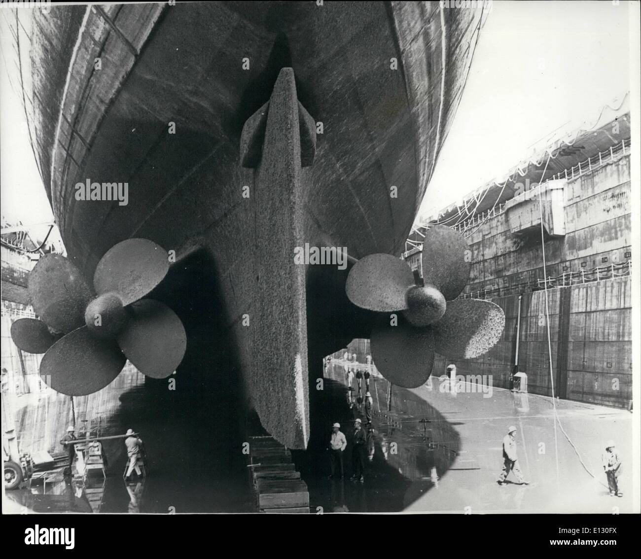 Feb. 26, 2012 - Queen Mary .. High and Dry.: The seagoing royal monarch R.M.S. Queen Mary rest proudly on blocks in the hugh Long Beach Naval Shipyard at drydock number one. During her six weeks on the ways, the Queen Mary will have threee of her four propellers removed, 94 openings in her hull closed, her bottom sandblasted and painted, various other conversion jobs attended to before returning to Pier E. in Long Beach, for final conversion to a multi-million dollar hotel-convention centre and maritime museum complex Stock Photo