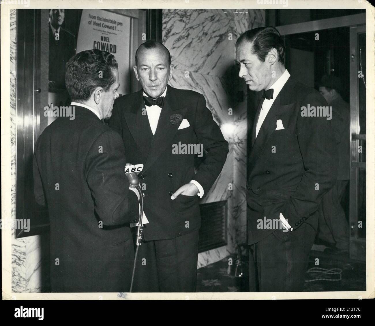 Feb. 26, 2012 - L-R: Allan Prescot, radio announcer, Noel Coward and Rex Harrison, at preview of Coward's new film in N.Y.C. Stock Photo