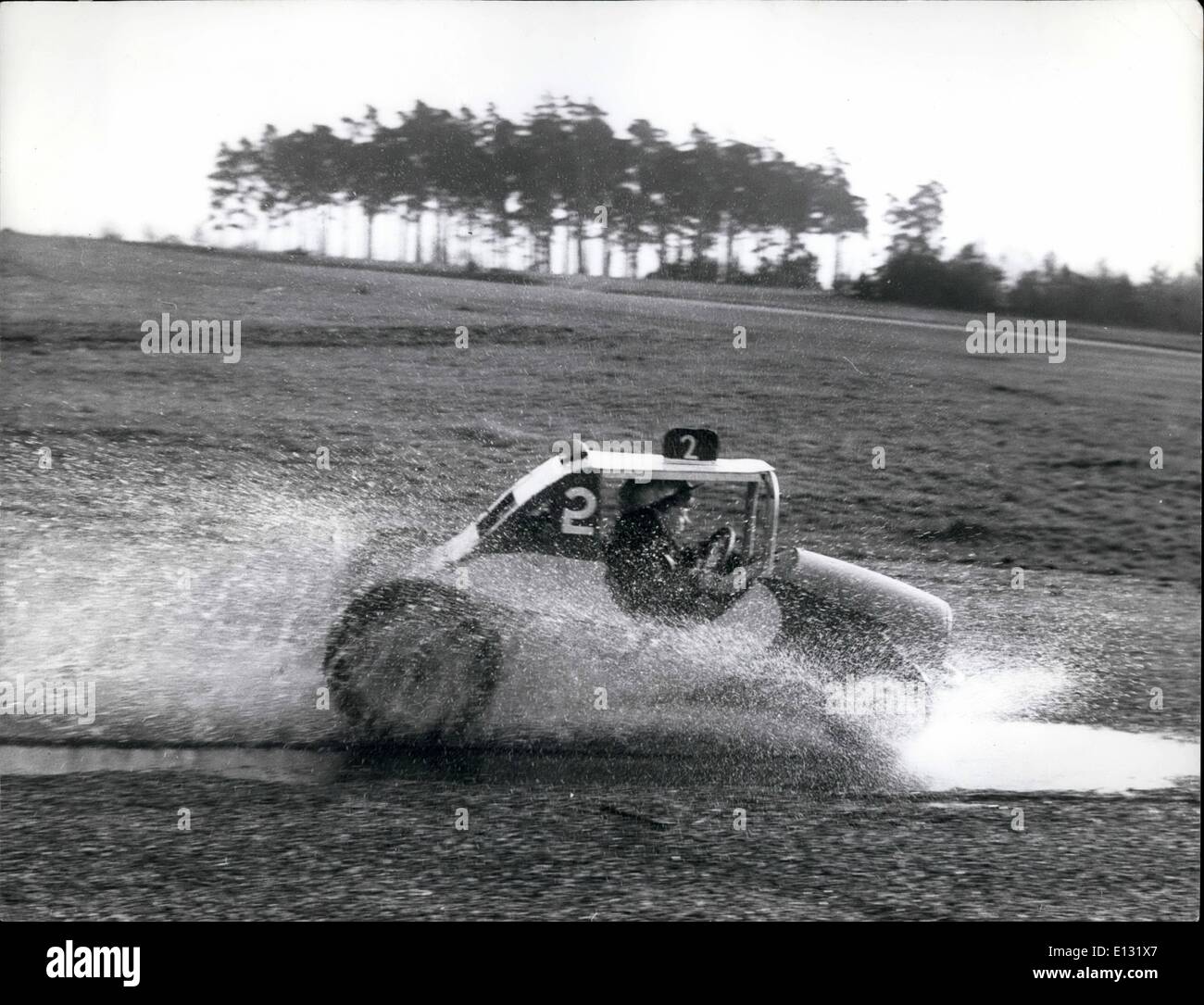 Feb. 26, 2012 - And through the water splash goes the 5-year old stock-car driver who thinks nothing of doing a few fast turns on the Common in his miniature car. Stock Photo